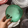 Irregular transparent colored glass bowl